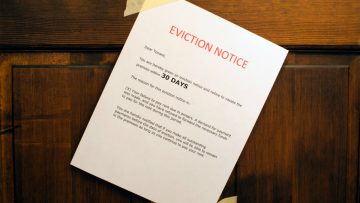 An eviction notice taped to a door.